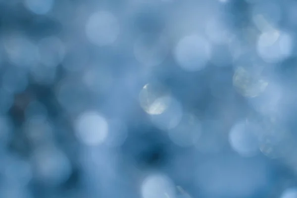 Abstract lens flare blue defocused bokeh snow — Stock Photo, Image