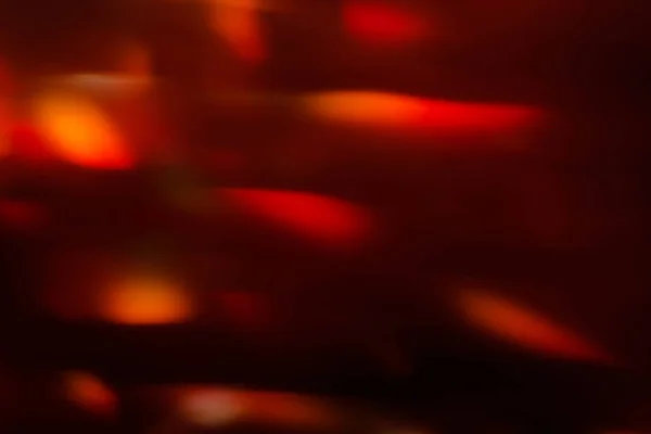 Lens flare röd suddig festliga bakgrundsbokeh — Stockfoto