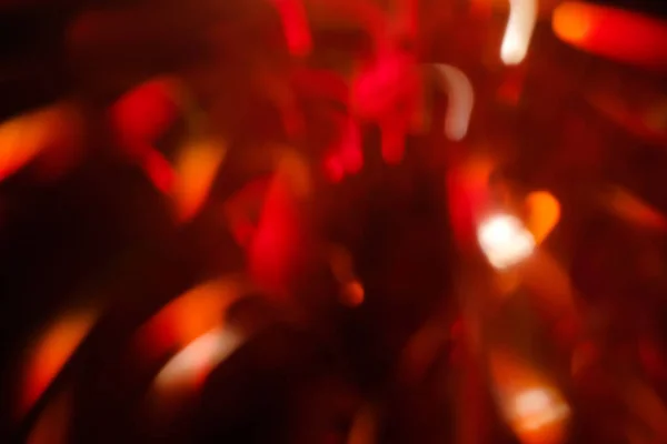 Lente llamarada roja borrosa festiva bokeh fuegos artificiales — Foto de Stock