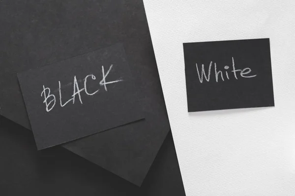black white contrast comparison extremity paper