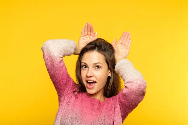 Funny playful carefree girl faking ears palm — Stock Photo, Image