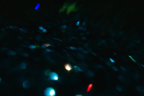 Lens flare bakgrunden i oskärpa festliga ljus — Stockfoto