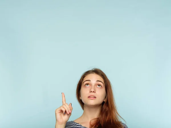 Look up advertising above girl point up finger — Stock Photo, Image