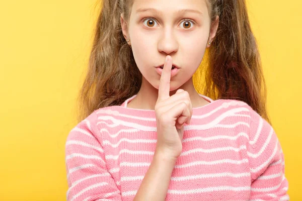 keep secret serious little girl finger lips