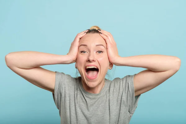 Excited enthusiastic woman scream hold head hands — Stock Photo, Image