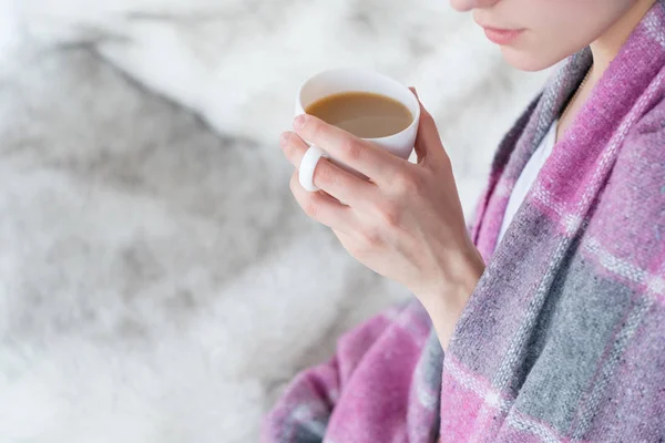 Woman blanket hold coffee mug drink hot beverage — Stock Photo, Image