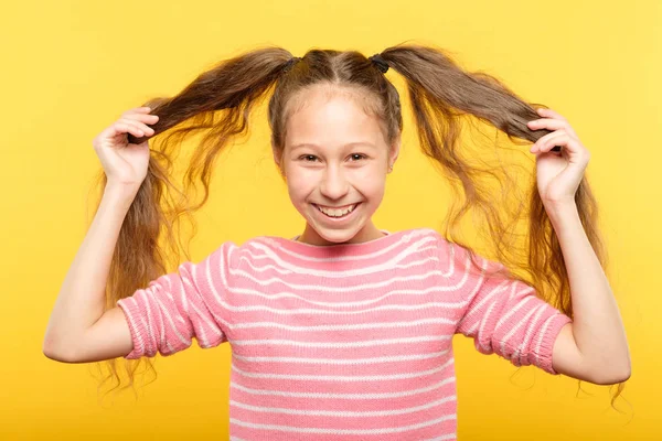 joyful adolescent girl pig tails hair childish