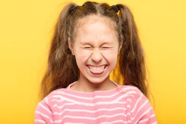 girl sticking tongue out laughing antics frolicking clipart