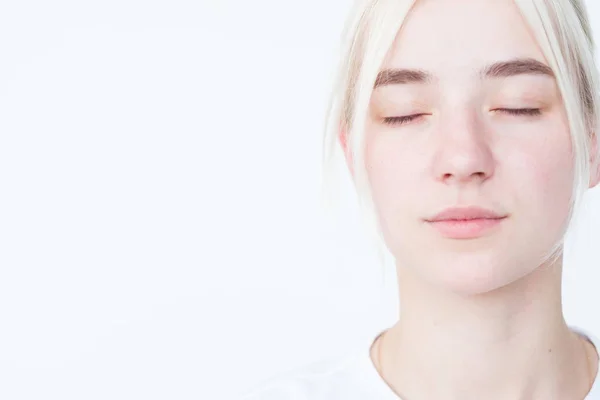 pensive mysterious woman eyes close portrait white