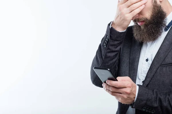 Man dekken gezicht telefoon bedrijf mislukking geld verlies — Stockfoto