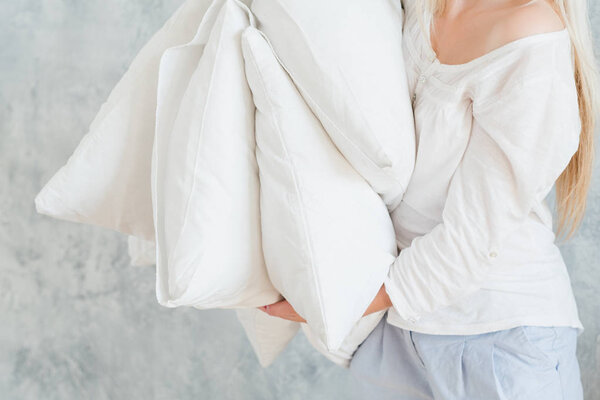 quality bedding sound sleep woman hold pillows