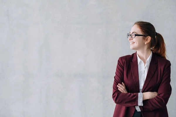 business career start woman arm crossed smiling