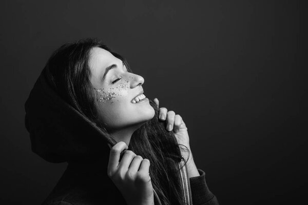 smiling young woman enjoying freedom closed eyes