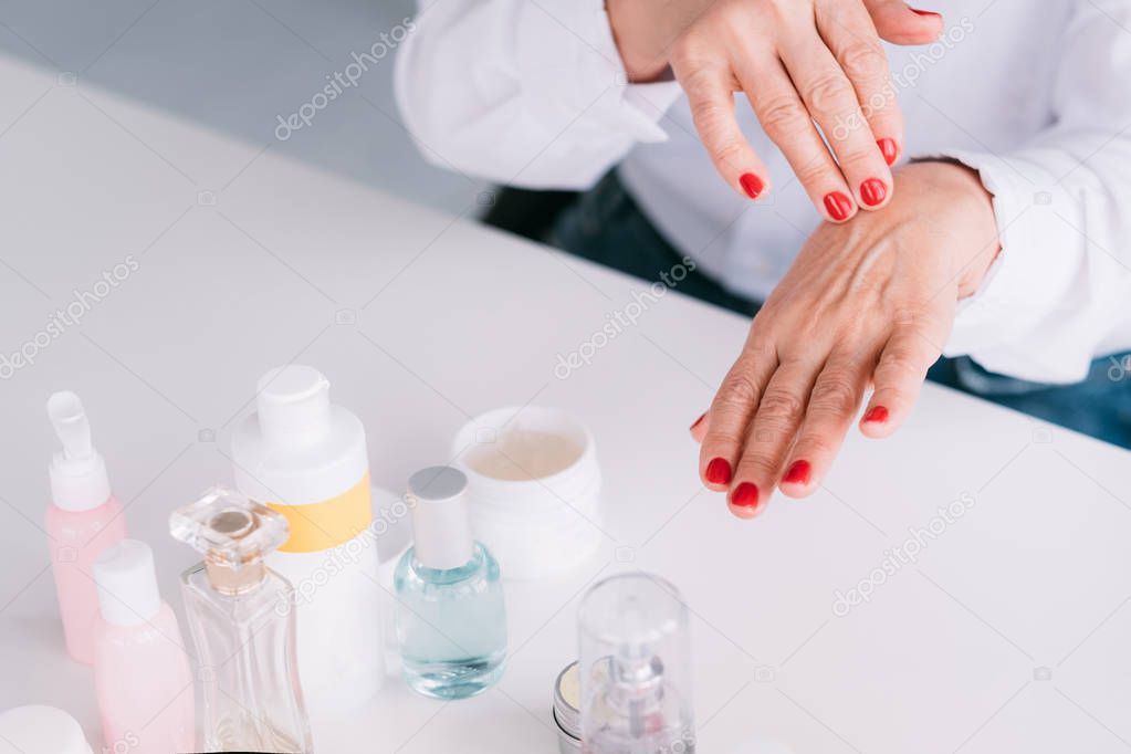 senior woman hand care skin beauty cosmetics