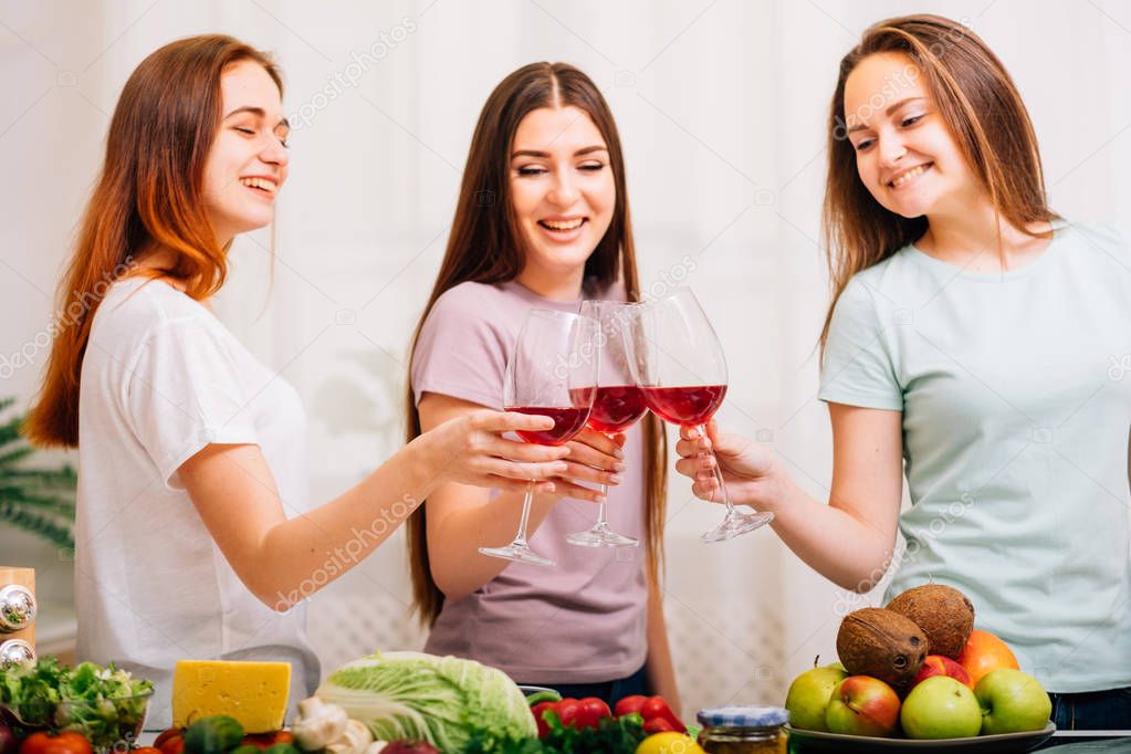 female party healthy food women clinking glasses