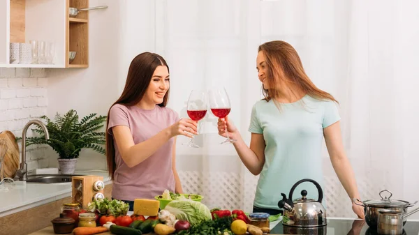 Close friends party kitchen women clinking glasses — Stock Photo, Image