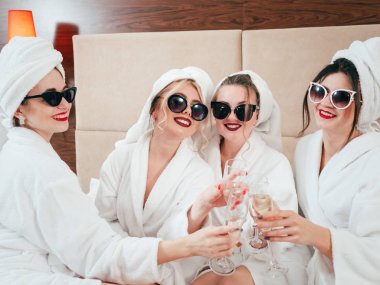 spa leisure relaxation females bathrobes champagne clipart