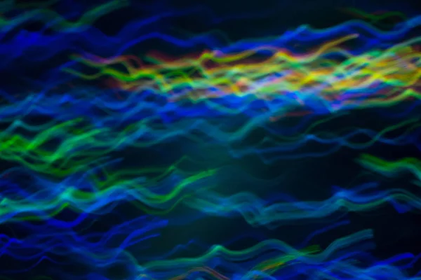 Linee ondulate sfocate movimento luci al neon sfocate — Foto Stock