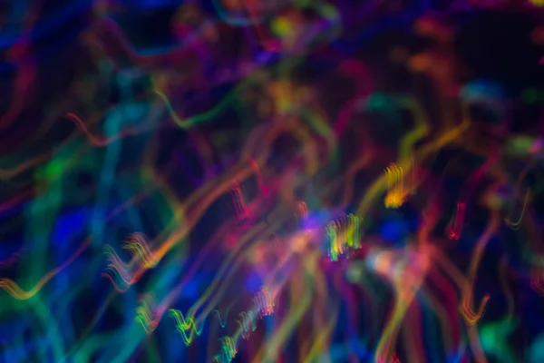 Kromme neon licht lijnen abstracte achtergrond wazig — Stockfoto