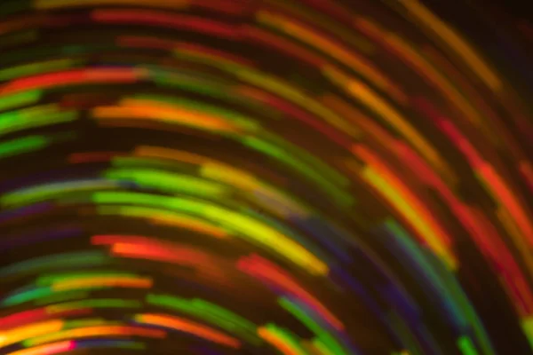 Neon whirl lines lens flare blur defocused light — Stock Photo, Image