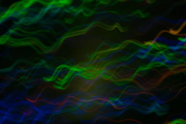 Rozostřit barevné vlnovky pohyby zaostřovala světla — Stock fotografie