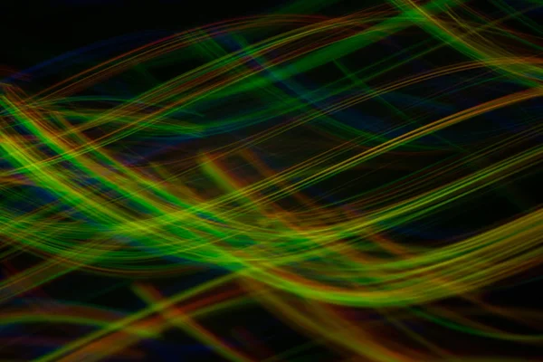 Kromme neon licht lijnen abstracte achtergrond wazig — Stockfoto