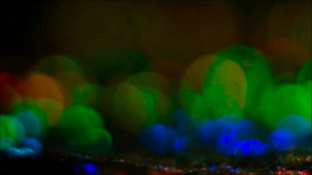 Colorful lens flare melting multicolor drops — Stock Video