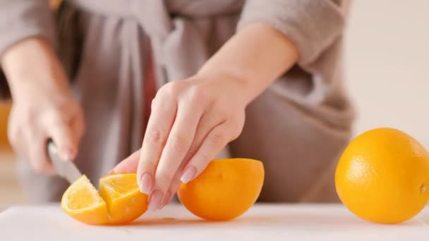 Woman bathrobe cutting orange healthy weight loss — ストック動画