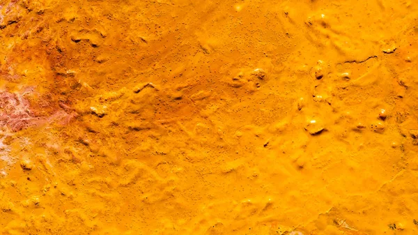 Abstrakte verschüttete orange Lackfarbe Hintergrund — Stockfoto