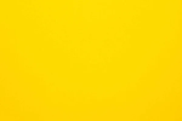 Papel de fundo de textura feltro amarelo brilhante — Fotografia de Stock