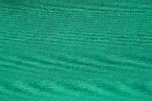 Вельветовый рисунок на фоне зеленого войлока — стоковое фото