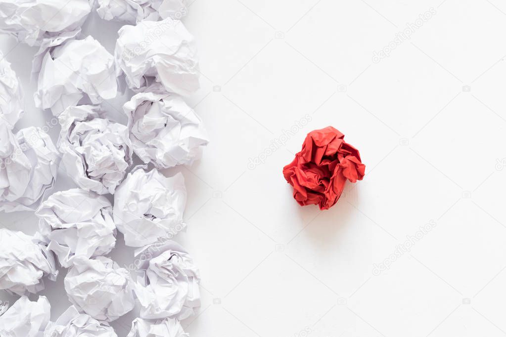 independence concept crumpled paper ball different
