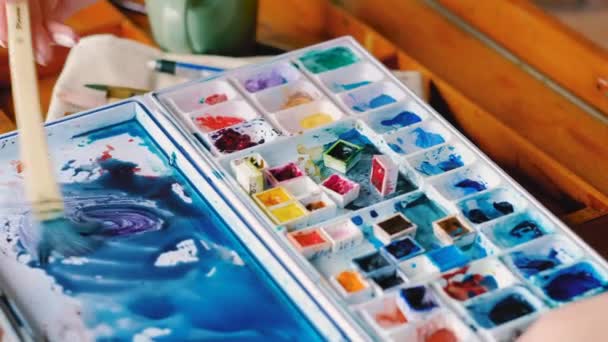 Mixing watercolor create new shade blue palette — Stock Video