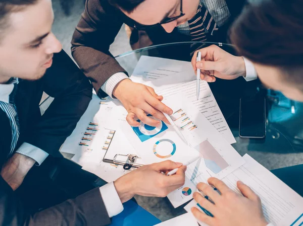 Teamwork brainstorming business partners graphs — Stock Photo, Image