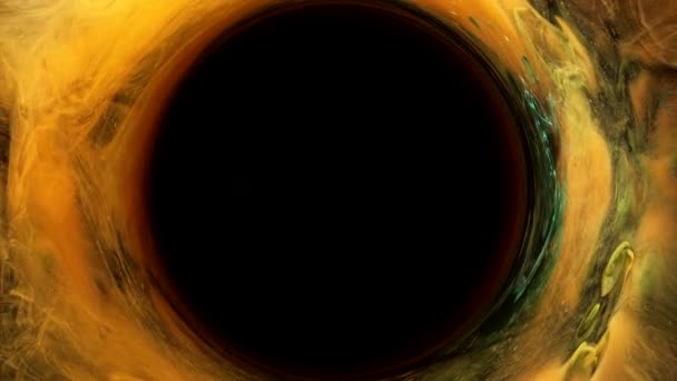 Ink swirl solar eclipse black hole golden circle — Stock Video