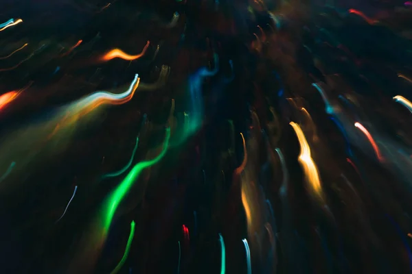 Neon mehrfarbig glühende geschwungene Linien fallende Funken — Stockfoto