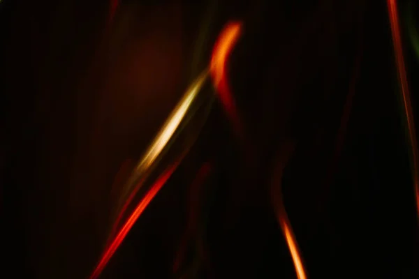Verwischen rote orangefarbene Linien defokussiert Feuerstrahlen dunkel — Stockfoto