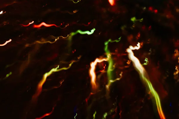 Neon çok renkli parlayan kıvrımlı çizgiler yağmur kıvılcım — Stok fotoğraf