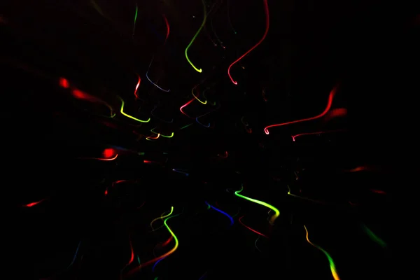 Multicolor gloeiende swirly lijnen feestelijke vonken — Stockfoto