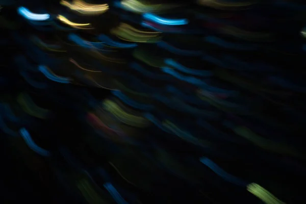 Blur nacht feestelijke verlichting neon blauw gele lijnen — Stockfoto