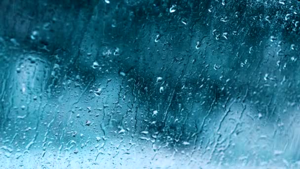 Rain drops motion water blue glass background — Stock Video