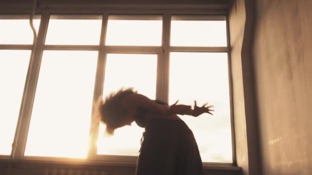 Spiritual dance woman free movements studio window — Stock Video