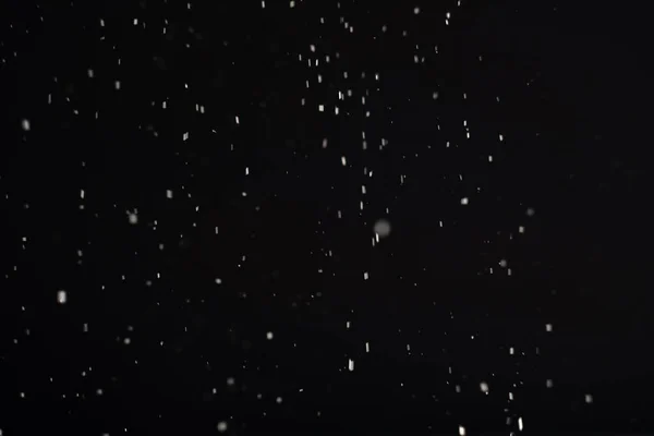 Dust background blur flying white ash flakes black — Stock Photo, Image