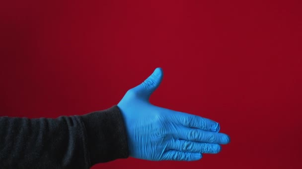 Pozdrowienie higiena covid-19 pandemiczny uścisk dłoni rękawica — Wideo stockowe