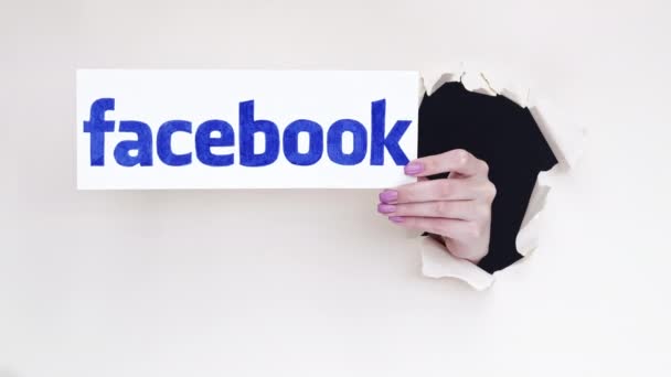 Facebook logo social media hand breakthrough paper — Stock Footage Facebook logo social media hand breakthrough paper Royalty Free Stock Video