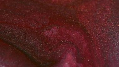 Köpüklü sıvı. Parlak mürekkep karışımı. Odaklanmamış kırmızı pembe renk parçacıkları dokusu karışık dalga soyut sanat arkaplanı.