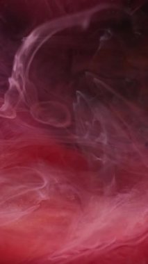 Dikey video. Buhar bulutu. Sanat sisi. Kırmızı pembe dalga patlaması sıvı boya akışı. Buhar pigmenti fırtınası soyut fırtına dağılımı odaklanmış arka plan.