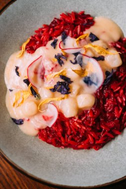 Seafood plate. Traditional meal. Paella with scallops garnished with dried saffron petals. Tomato rice aromatic spicy dish in creamy sauce.