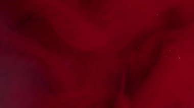 Parıltılı buhar. Sis girdabı. Odaklanmamış kırmızı, mor, mürekkep rengi, akrilik soyutlama üzerinde yüzen parlak pigment sıvısı..