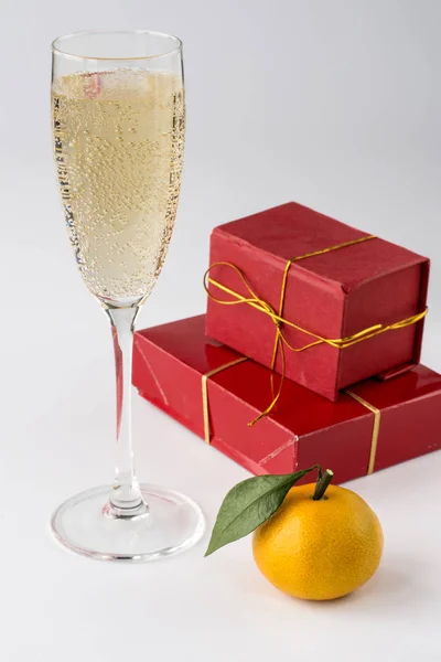 delicious tangerines with surprises gifts and a glass of champagne for the new year